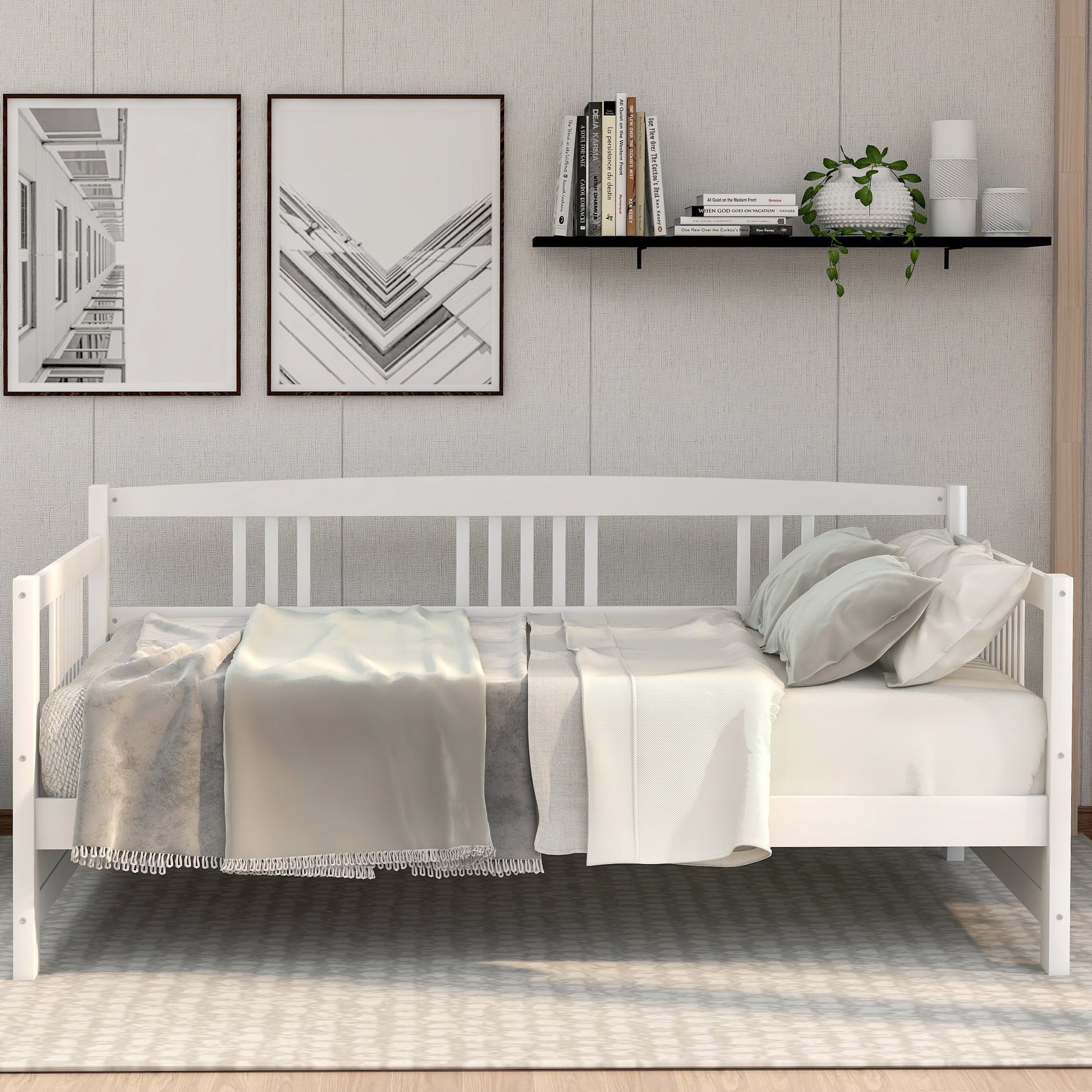 White wooden daybed with white bedding and pillows