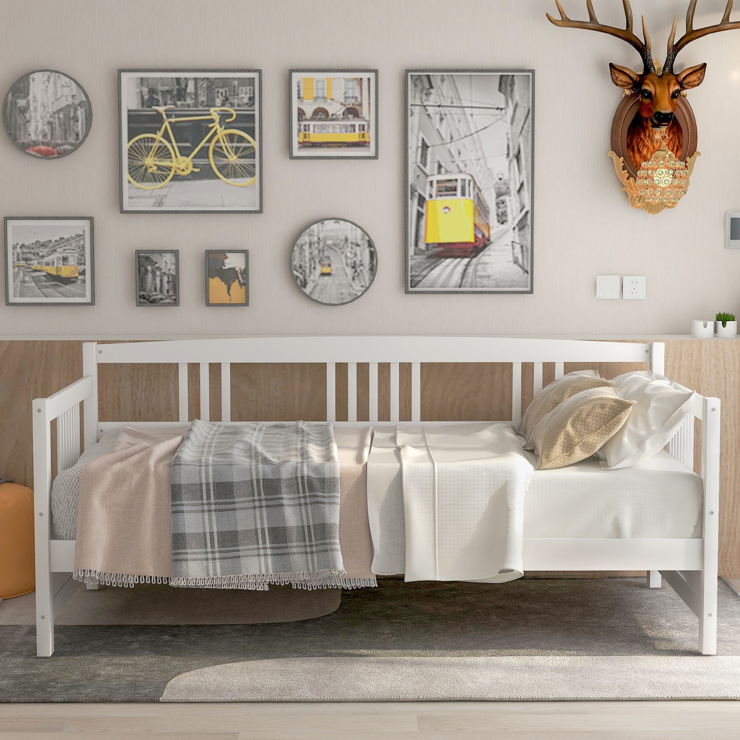 White wooden daybed with plaid and solid throw blankets