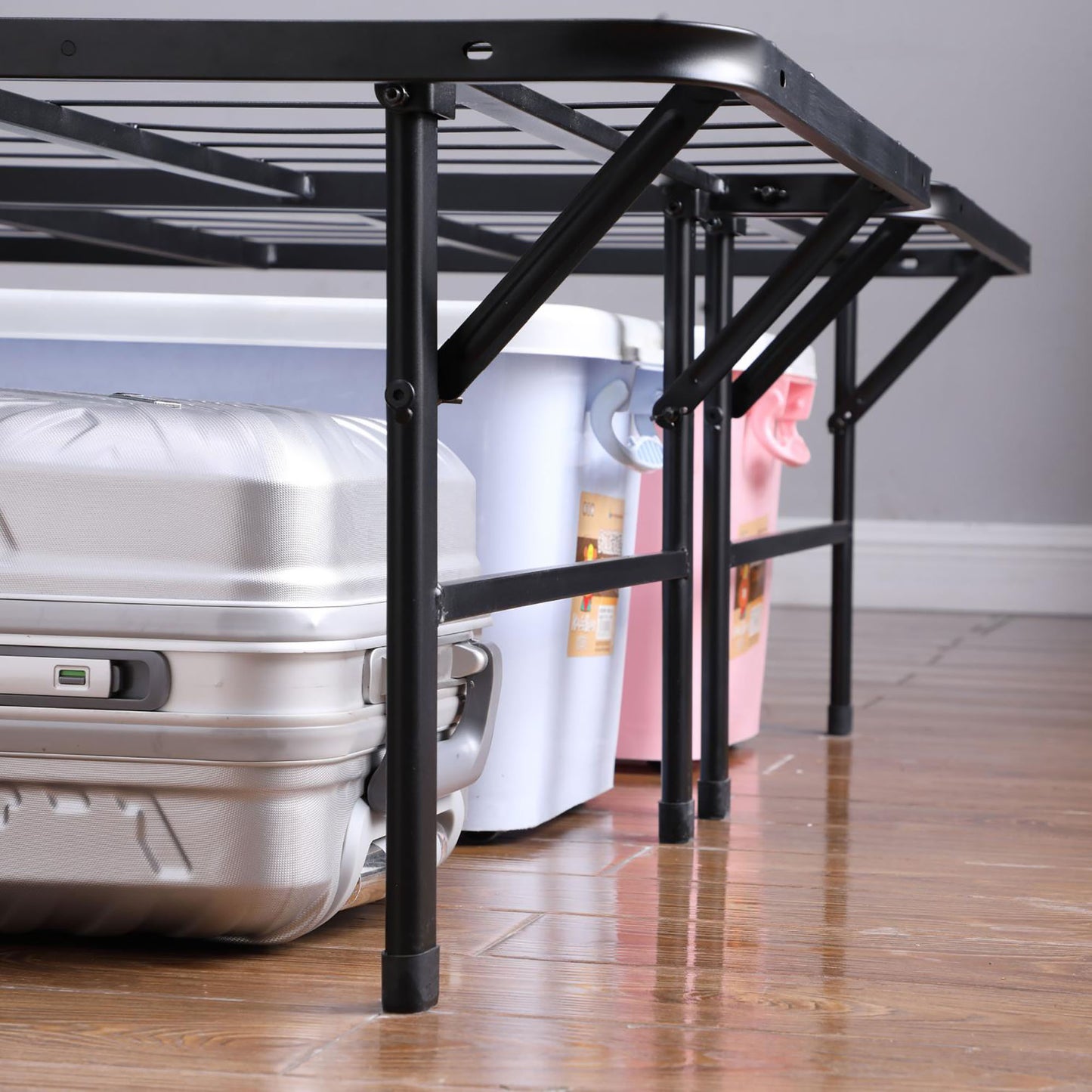 Black metal folding bed frame with ample underbed storage space