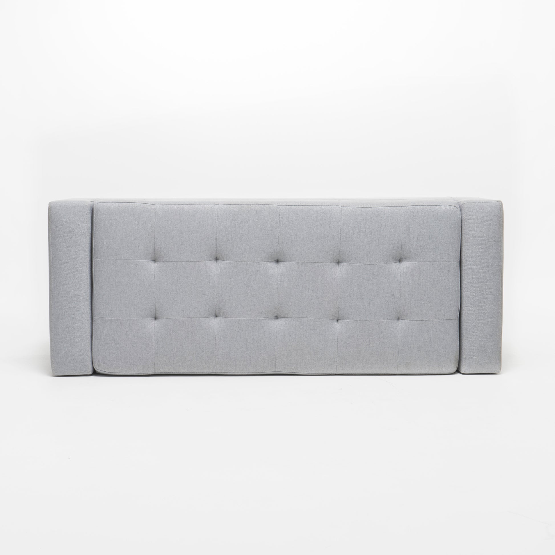 Grey upholstered headboard with diamond tufting and side panels
