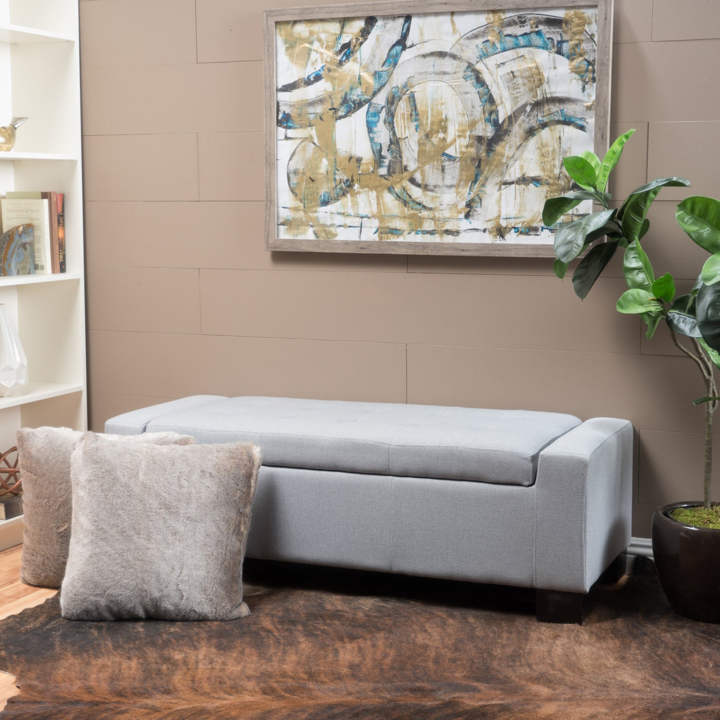 Tufted light gray fabric storage ottoman with dark wood legs