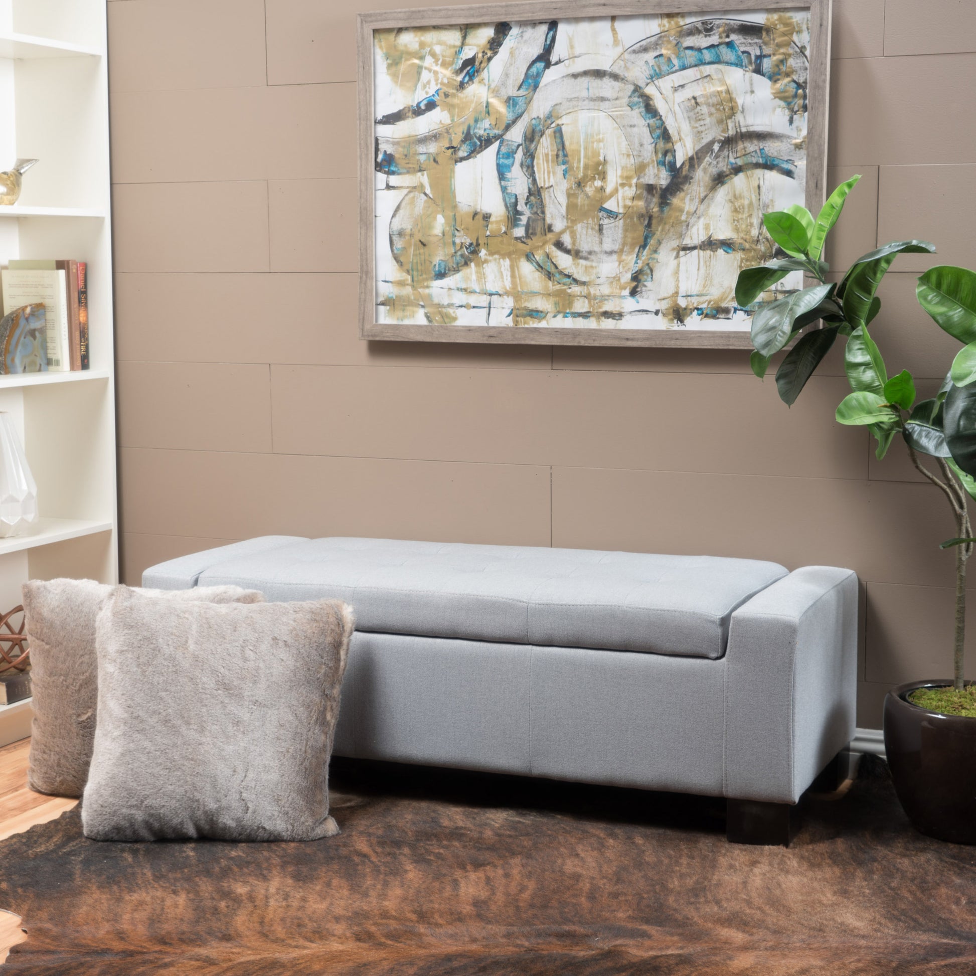 Tufted light gray fabric storage ottoman with dark wood legs