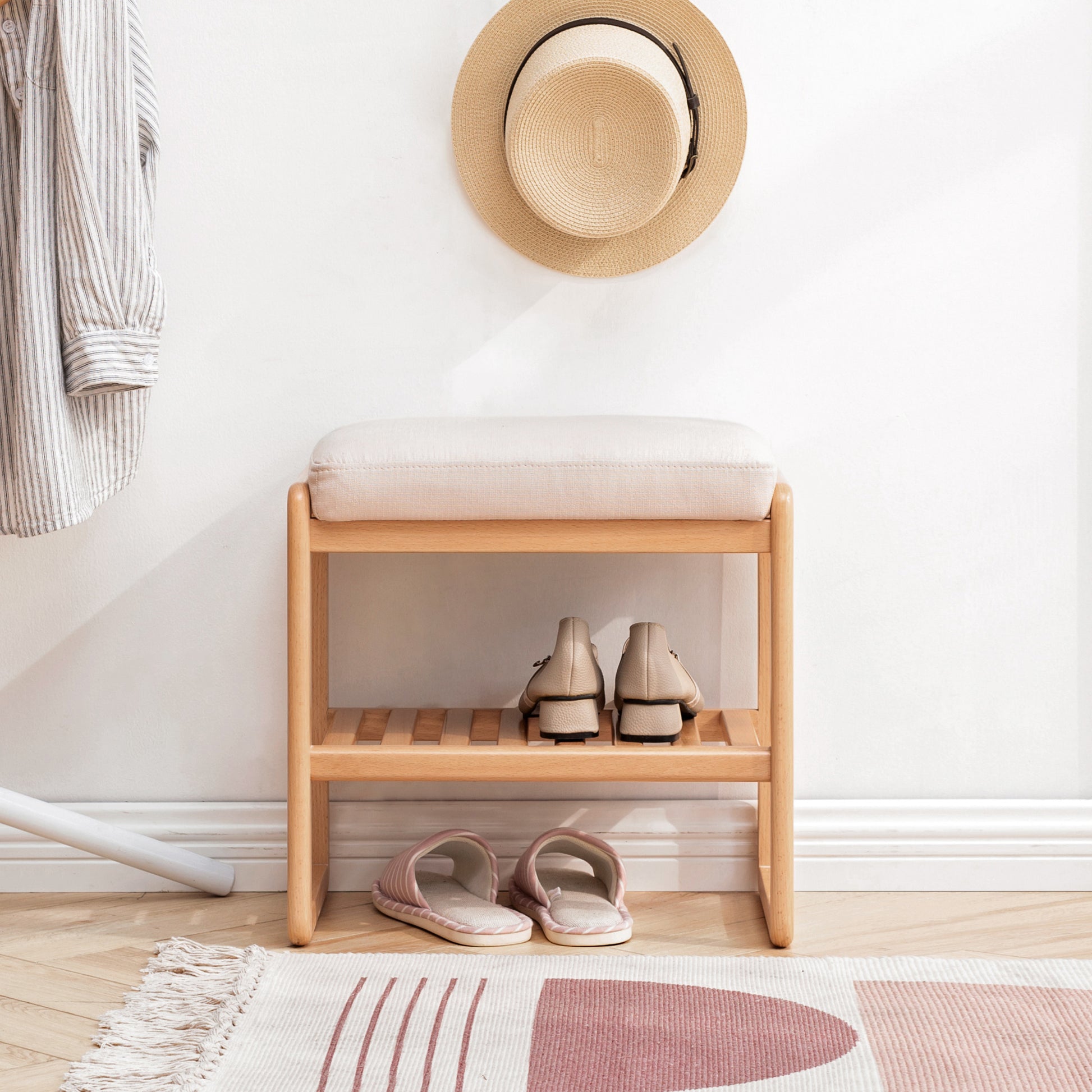 Modern entryway bench with cushioned seat and twotier shoe rack in natural wood