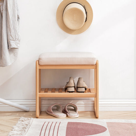 Modern entryway bench with cushioned seat and twotier shoe rack in natural wood
