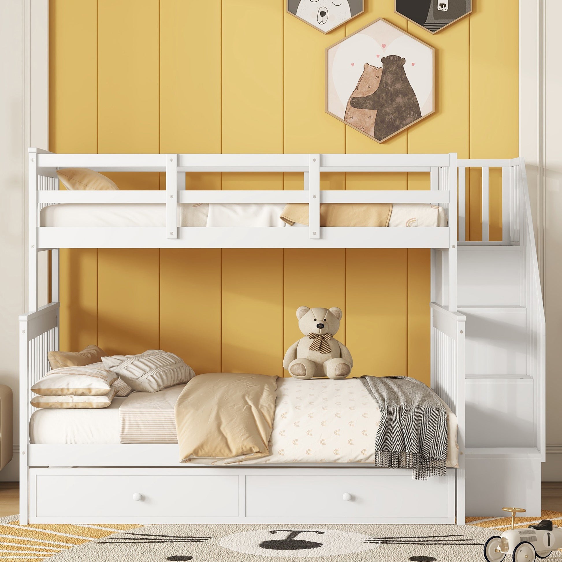 White wooden twin over twin bunk bed with storage drawers and stairs