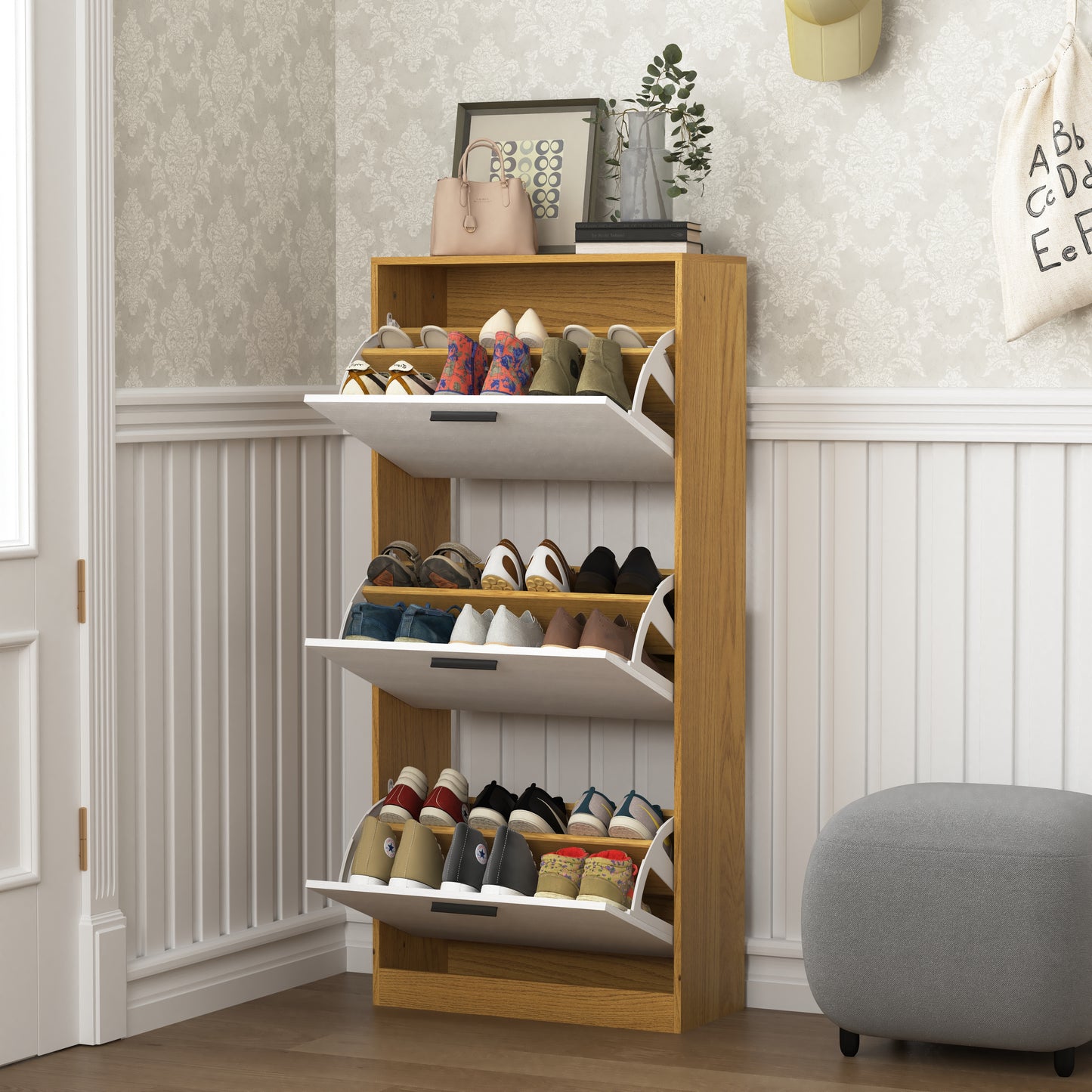Compact wooden shoe cabinet with three flipout drawers storing various shoes