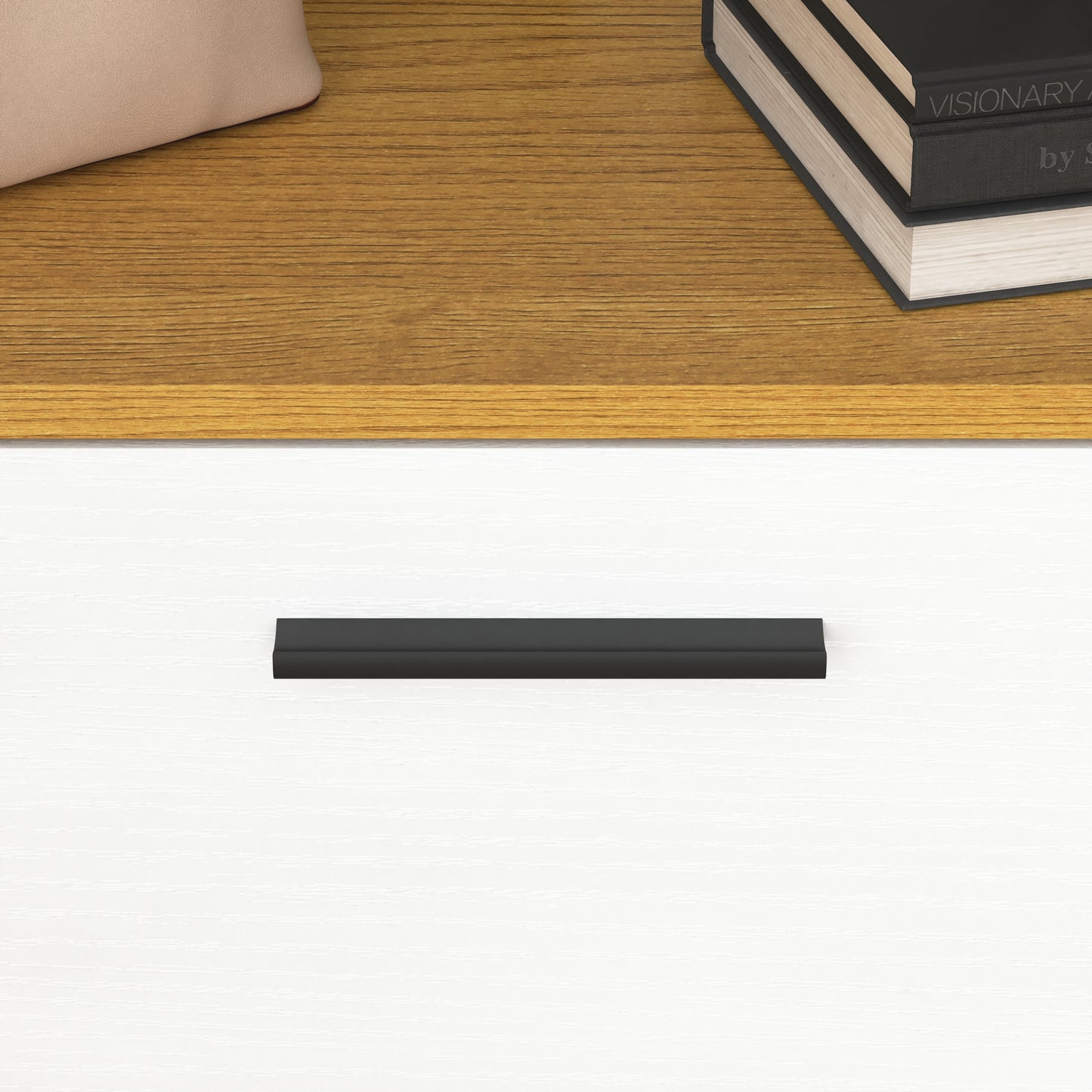Modern black drawer pull on white textured cabinet