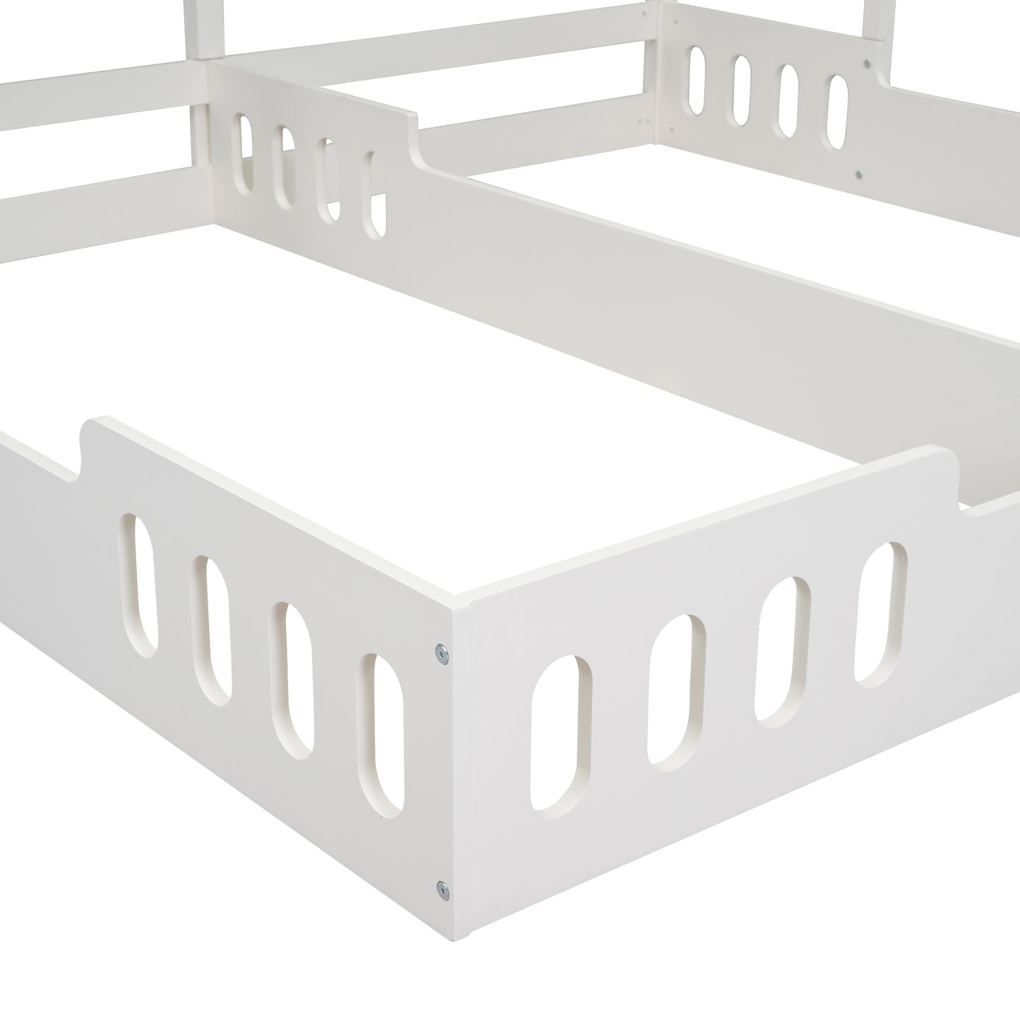 White wooden bed frame corner with cutout details