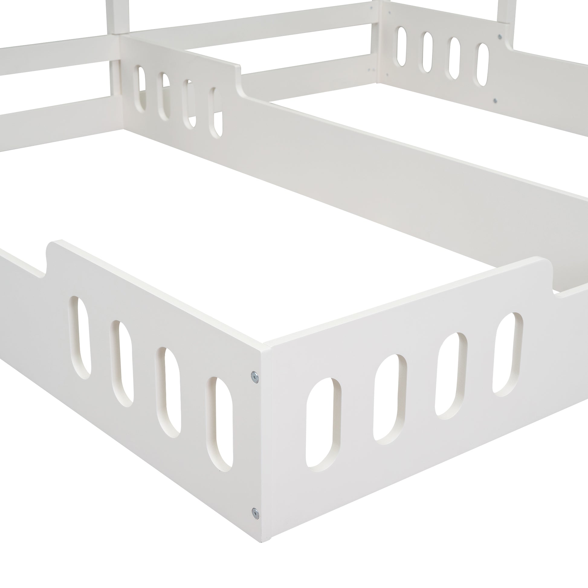 White wooden bed frame corner with cutout details