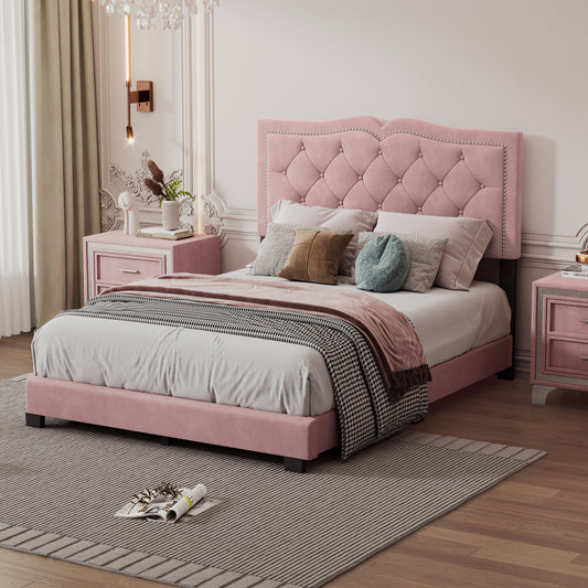 Pink velvet tufted bed with crystal accents and plush bedding
