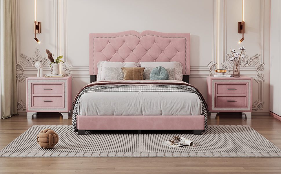Pink velvet upholstered bed with diamond tufted headboard and silver nailhead trim