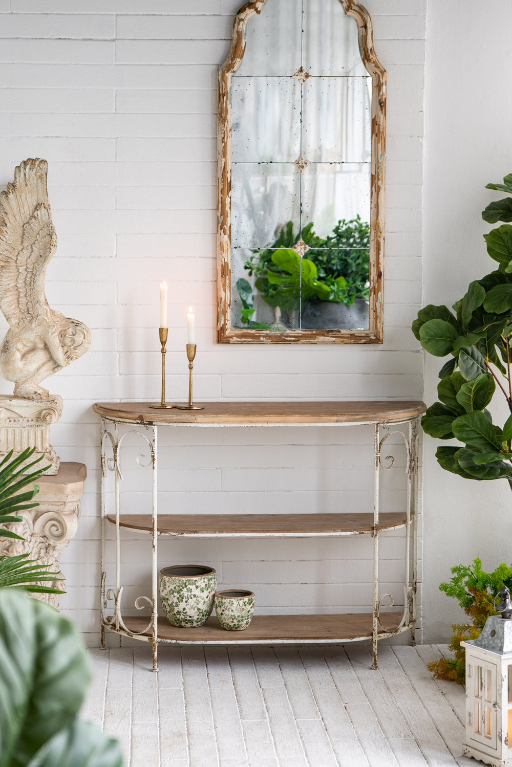 Distressed antique mirror with ornate distressed wood frame