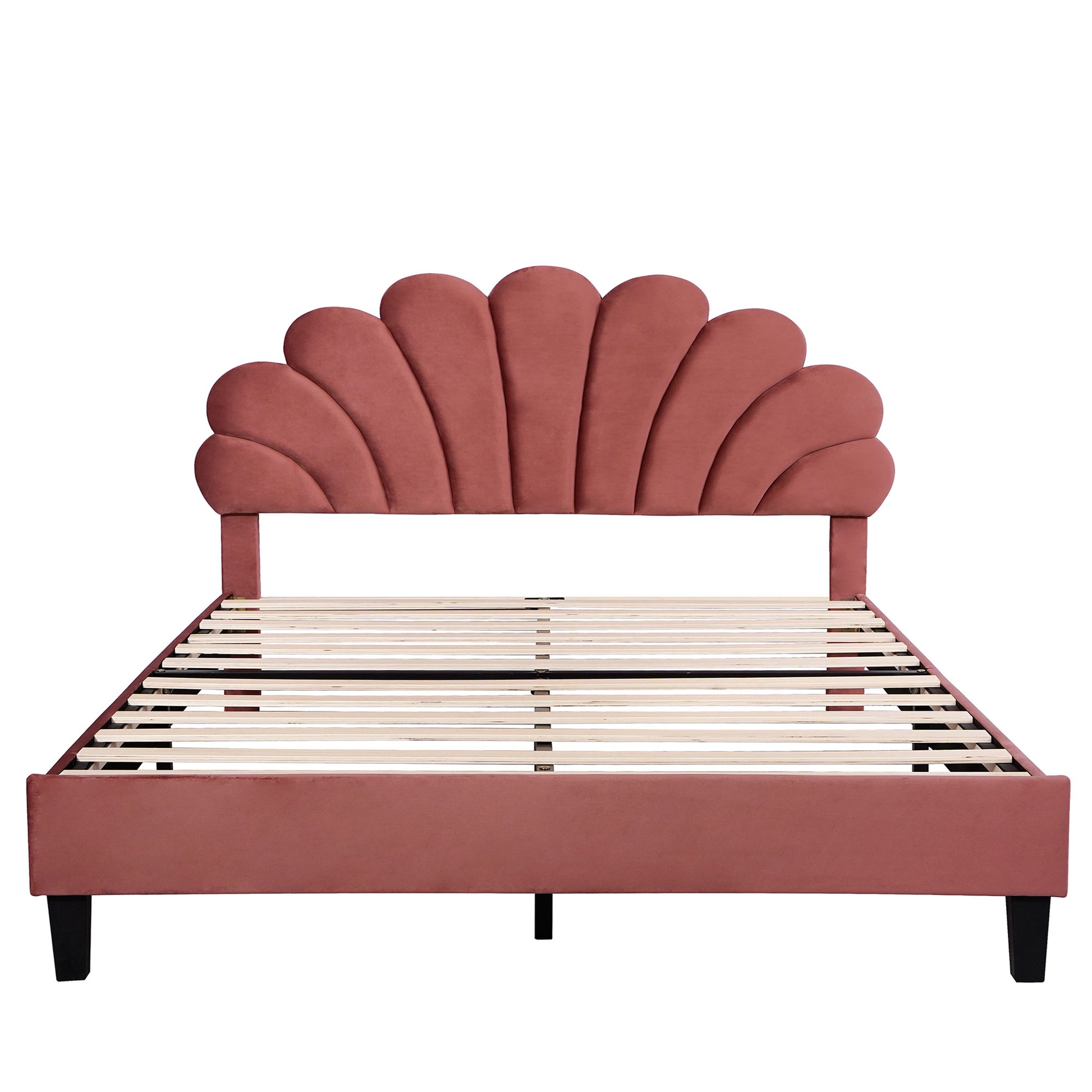 Pink velvet bed frame with unique shellshaped headboard and wooden slats