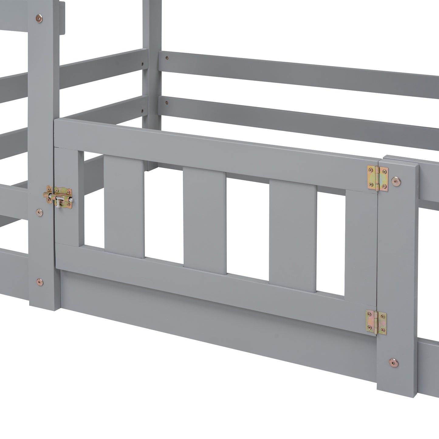 Closeup of grey wooden toddler bed rails with a silver latch