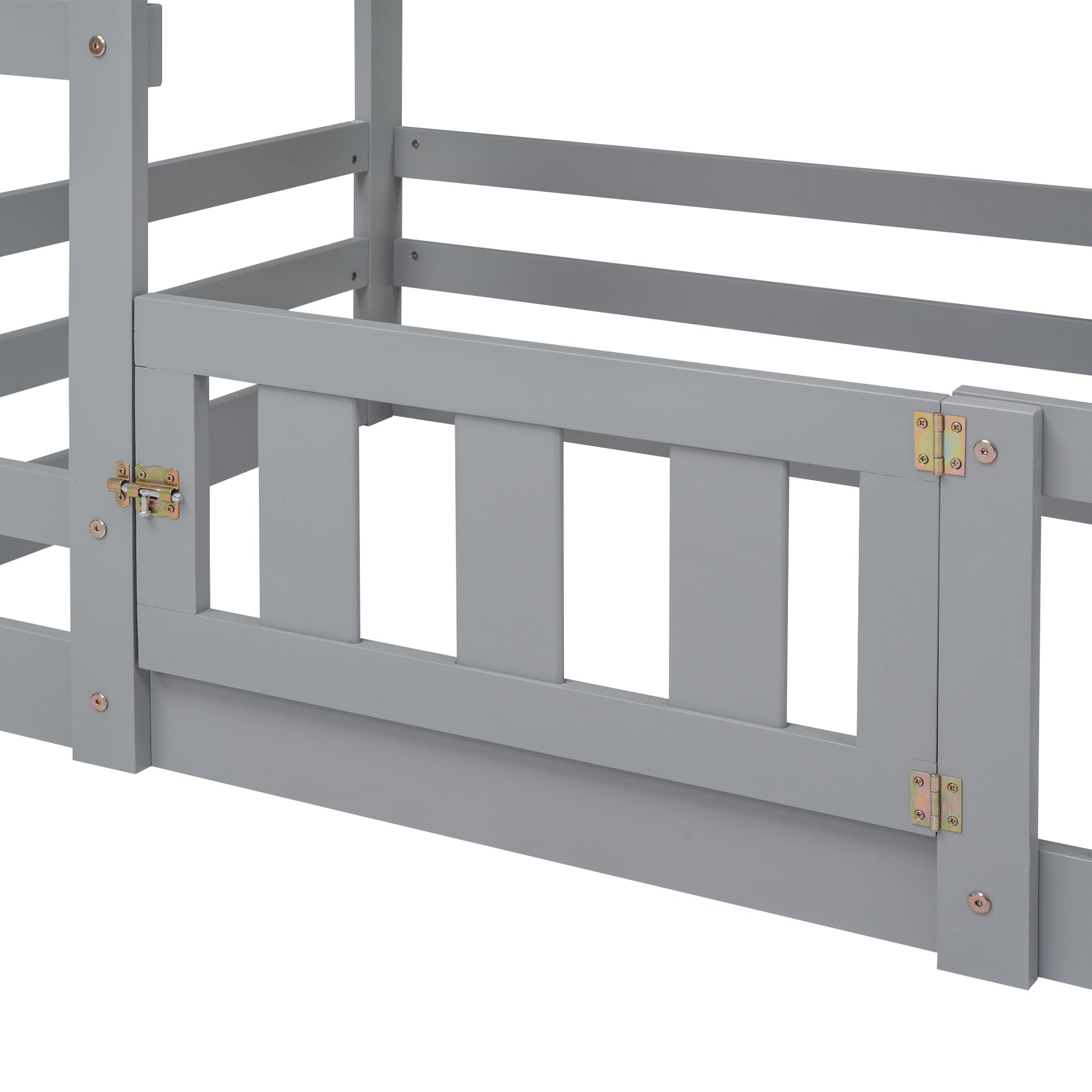 Closeup of grey wooden toddler bed rails with a silver latch