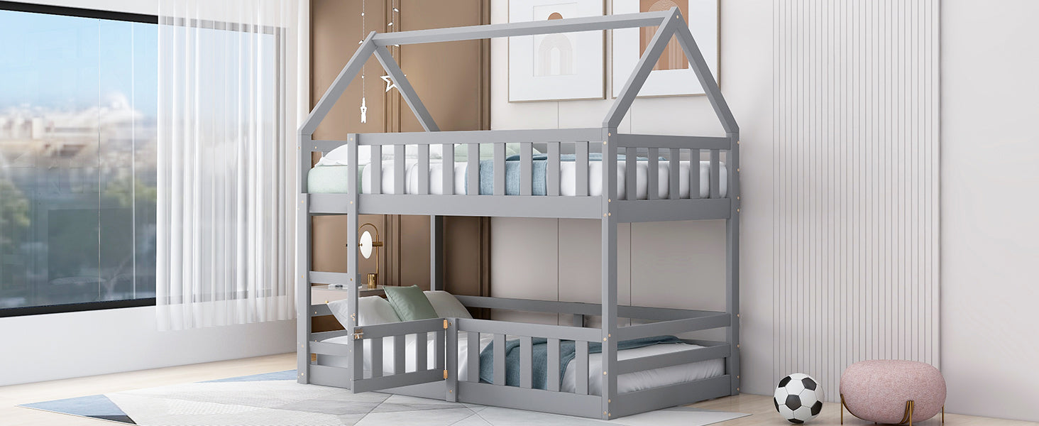 Gray wooden house bunk bed with twin mattresses and safety rails
