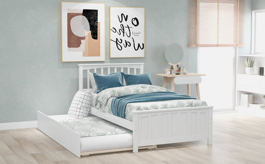 White wooden toddler bed with pullout trundle for kids rooms