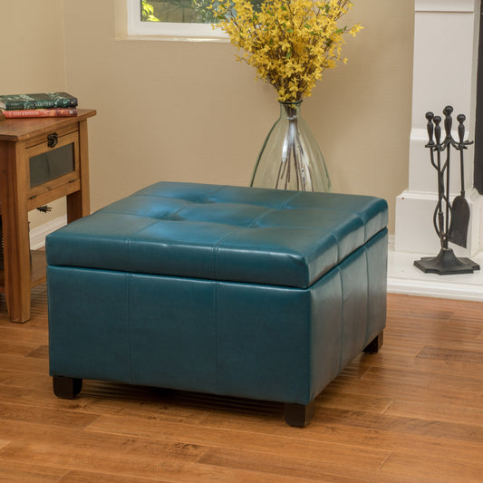 Tufted teal faux leather storage ottoman with wooden feet