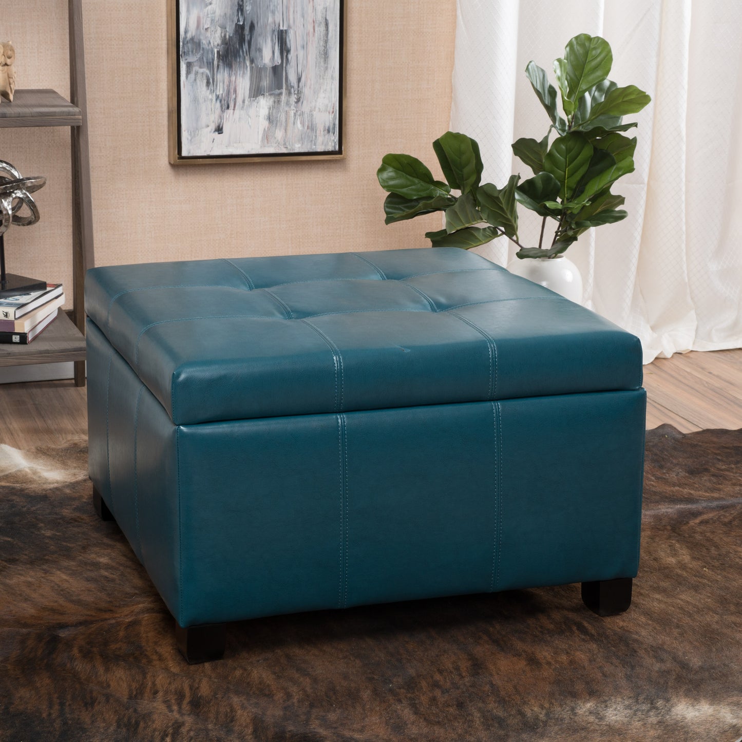 Teal tufted leather storage ottoman with square feet
