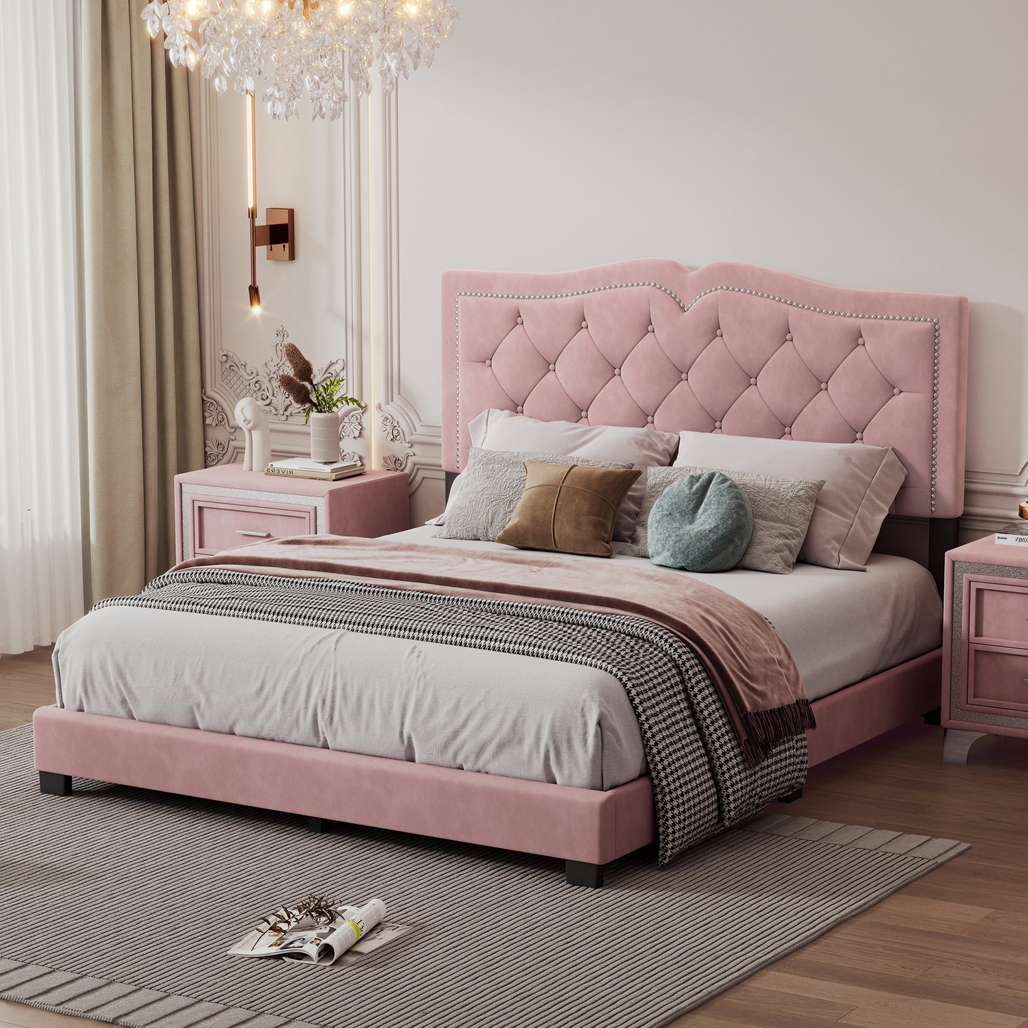 Pink velvet tufted bed with silver nailhead trim