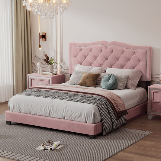 Pink velvet tufted bed with silver nailhead trim