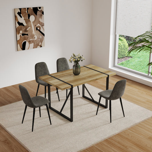 Rustic oak dining table with black metal legs seats four chairs