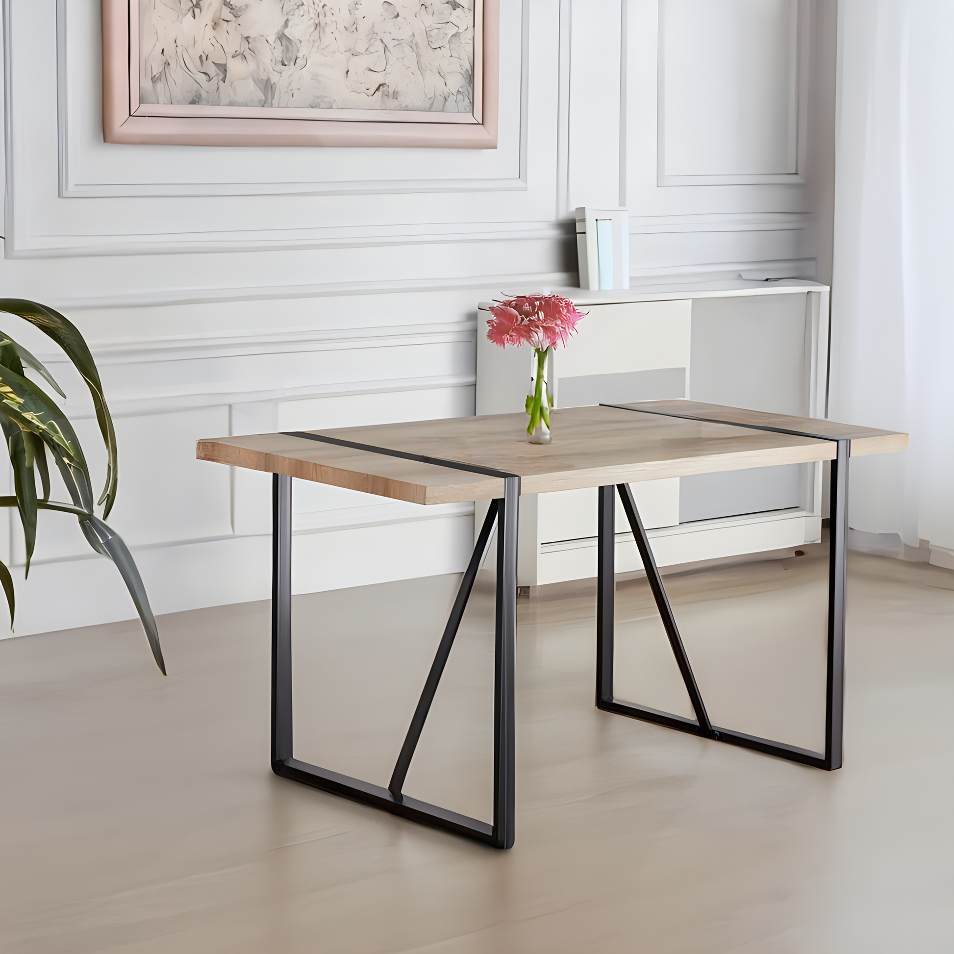 Modern oak dining table with black metal legs and a light wood grain finish