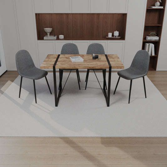 Rustic wood dining table with black metal legs and four gray fabric chairs