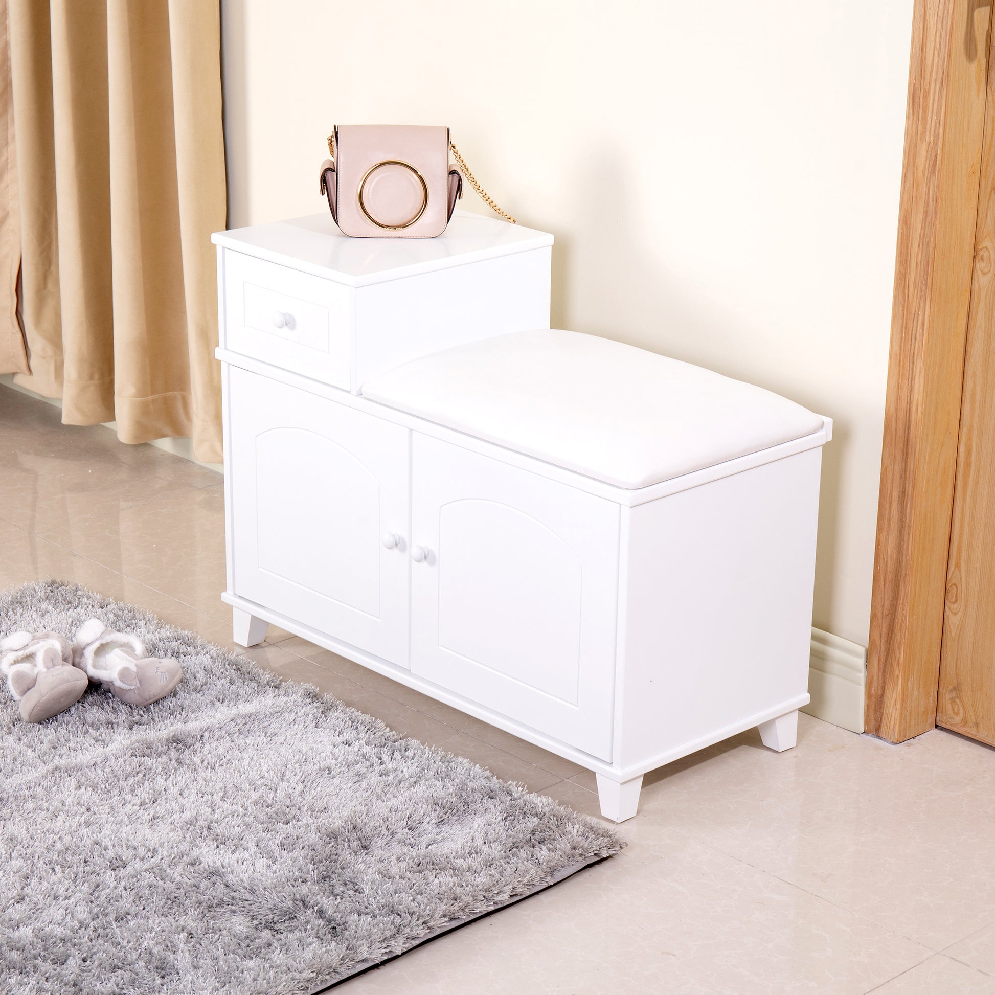White wooden shoe bench with cushioned seat and storage drawers