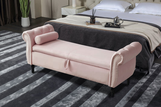 Pink velvet storage bench with tufted accents and silver nailhead trim