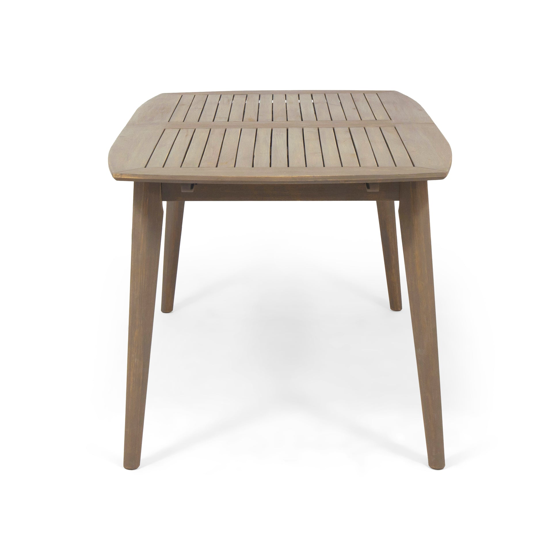 A light brown wooden slatted patio table with angled legs