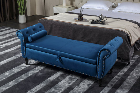 Blue velvet storage bench with tufted detailing and nailhead trim