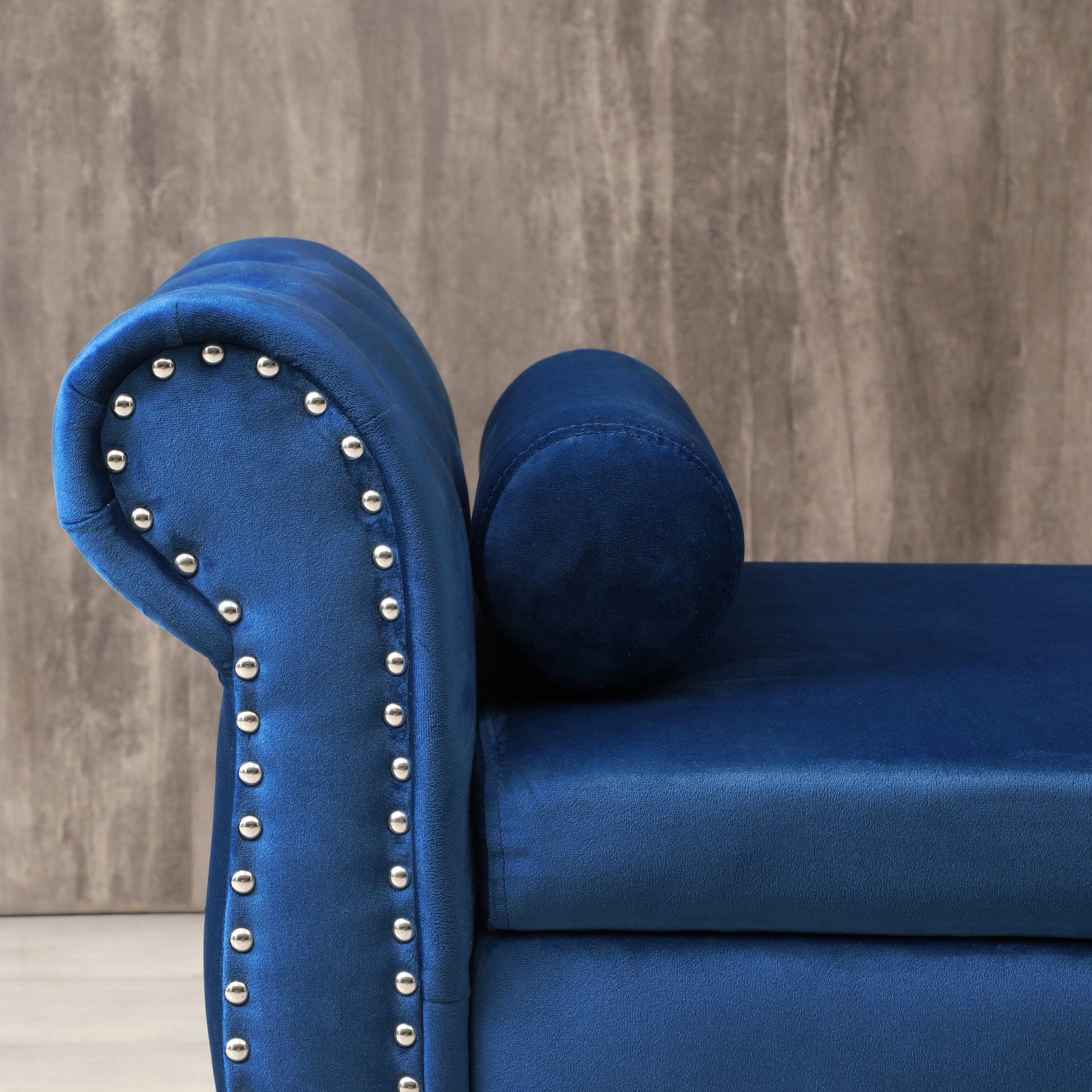Deep blue velvet chaise lounge with silver nailhead trim
