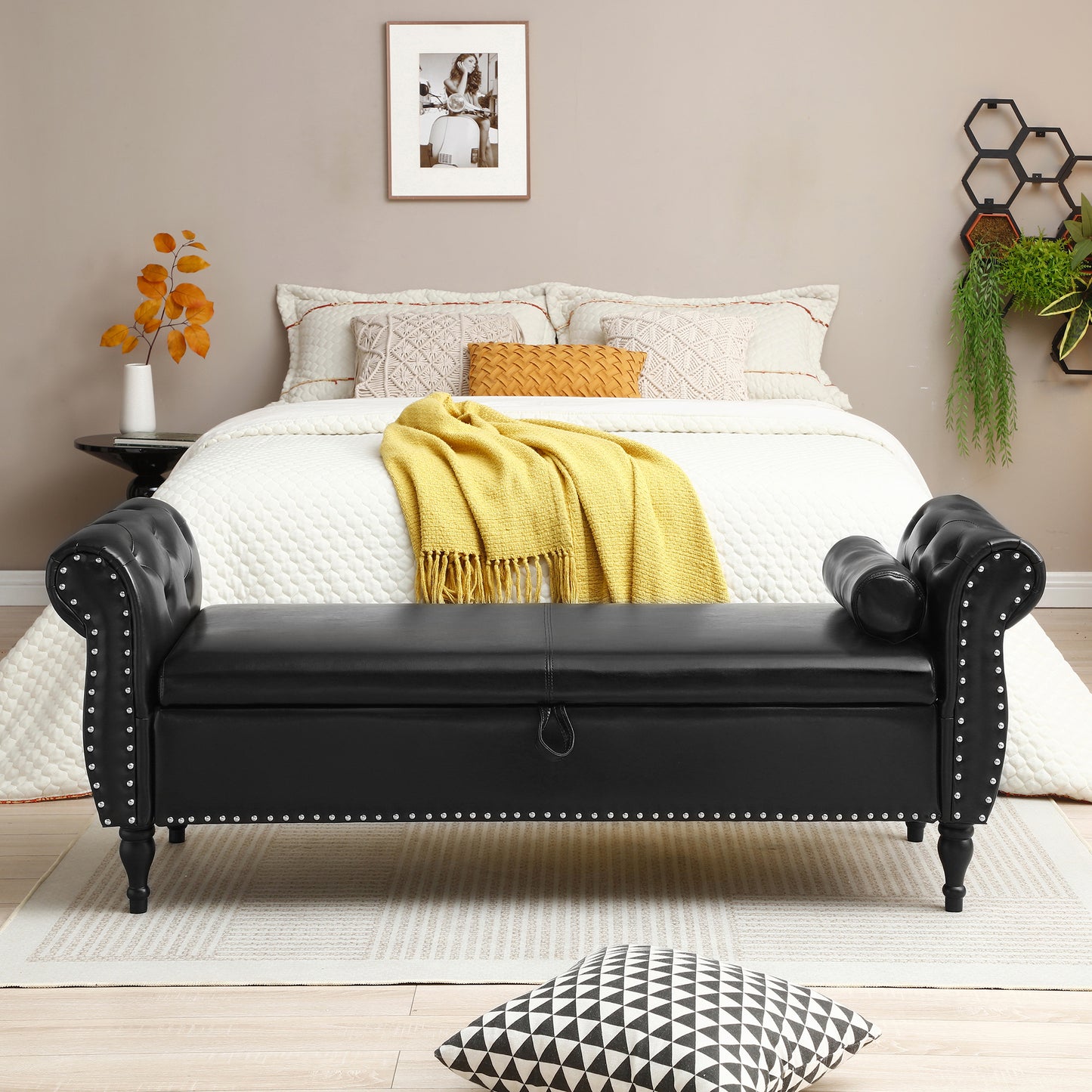 Black faux leather tufted storage bench with silver nailhead trim