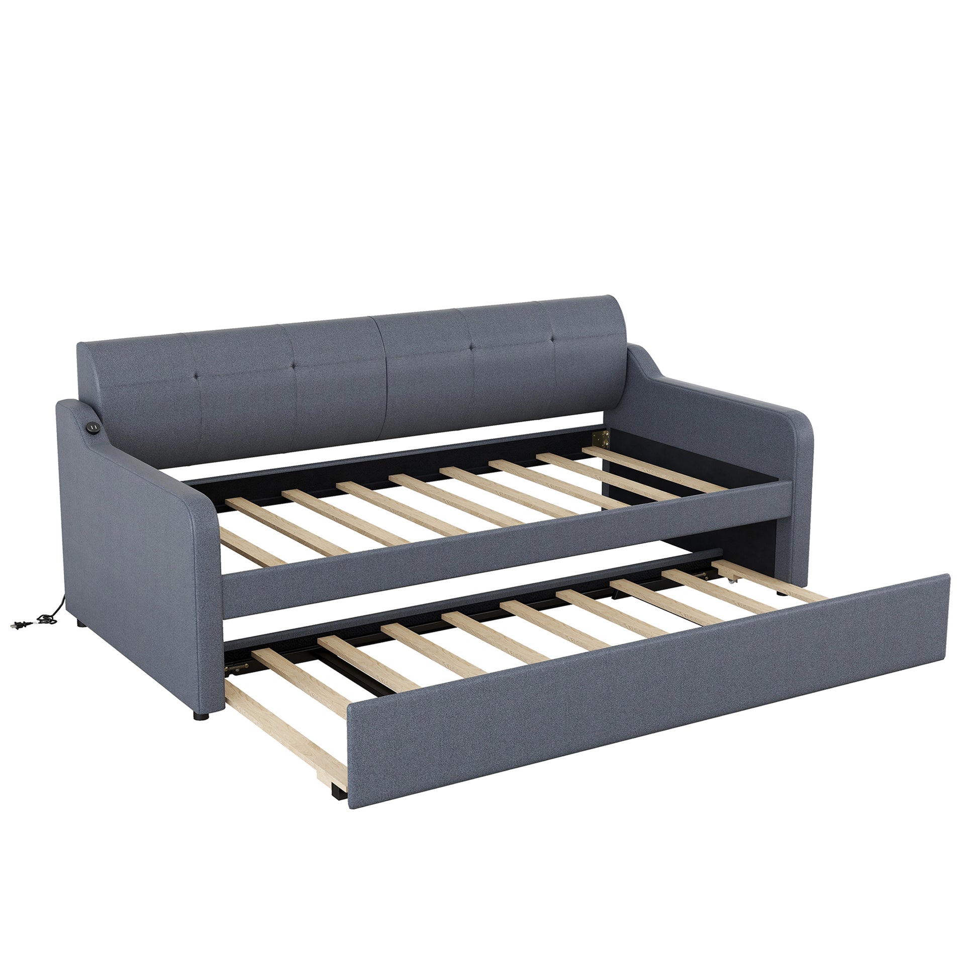 Grey upholstered daybed with pullout trundle extended and exposed wooden slats