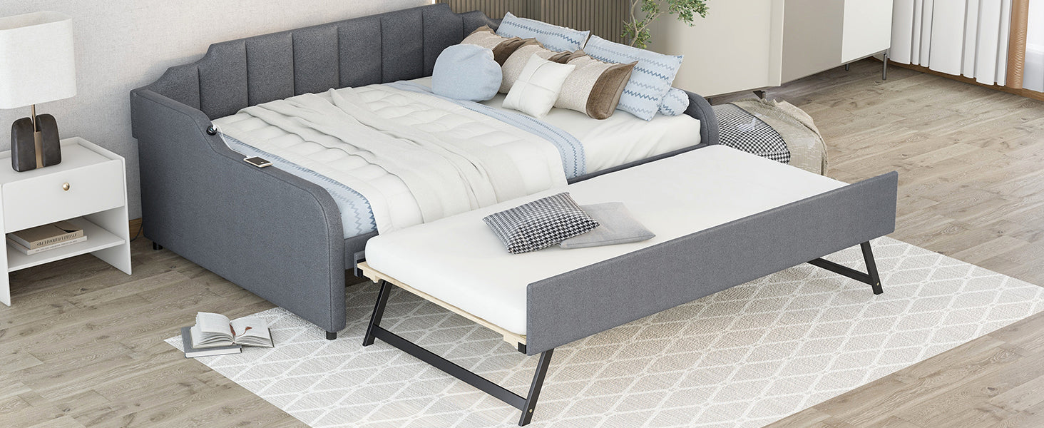 Gray upholstered daybed with pullout trundle perfect for small spaces