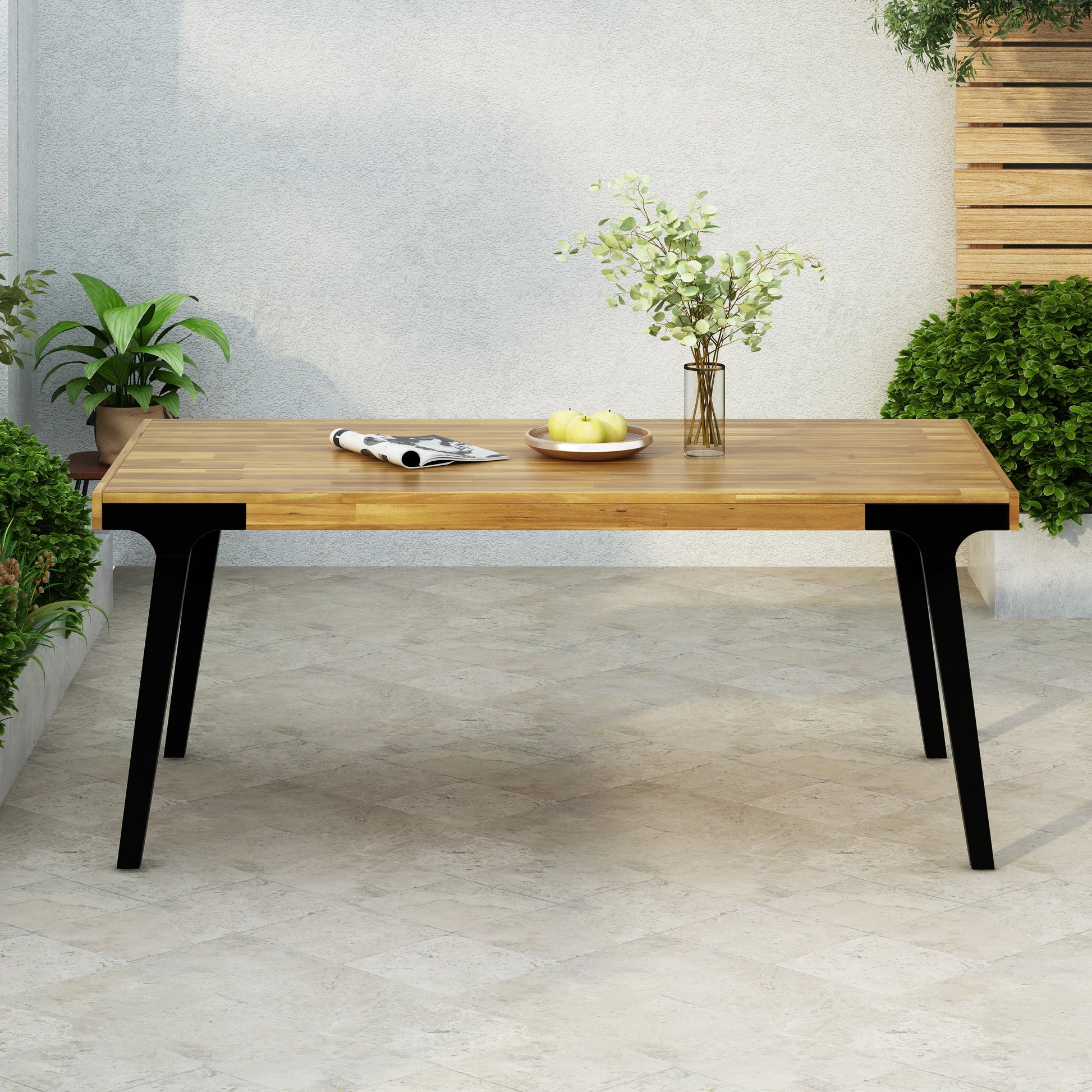 Solid wood dining table with black metal legs perfect for outdoor patio use