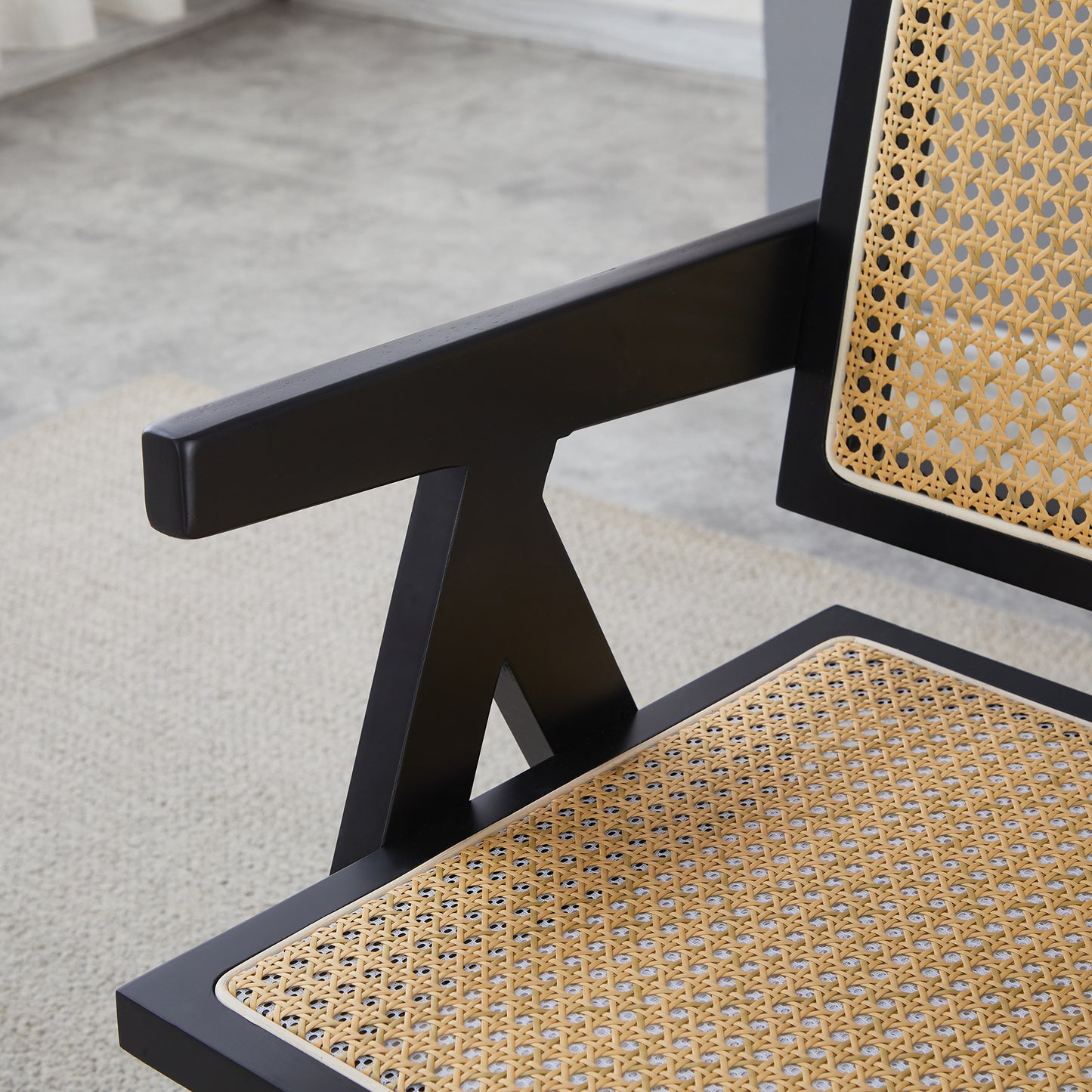 Black modern armchair with natural cane webbing seat and back