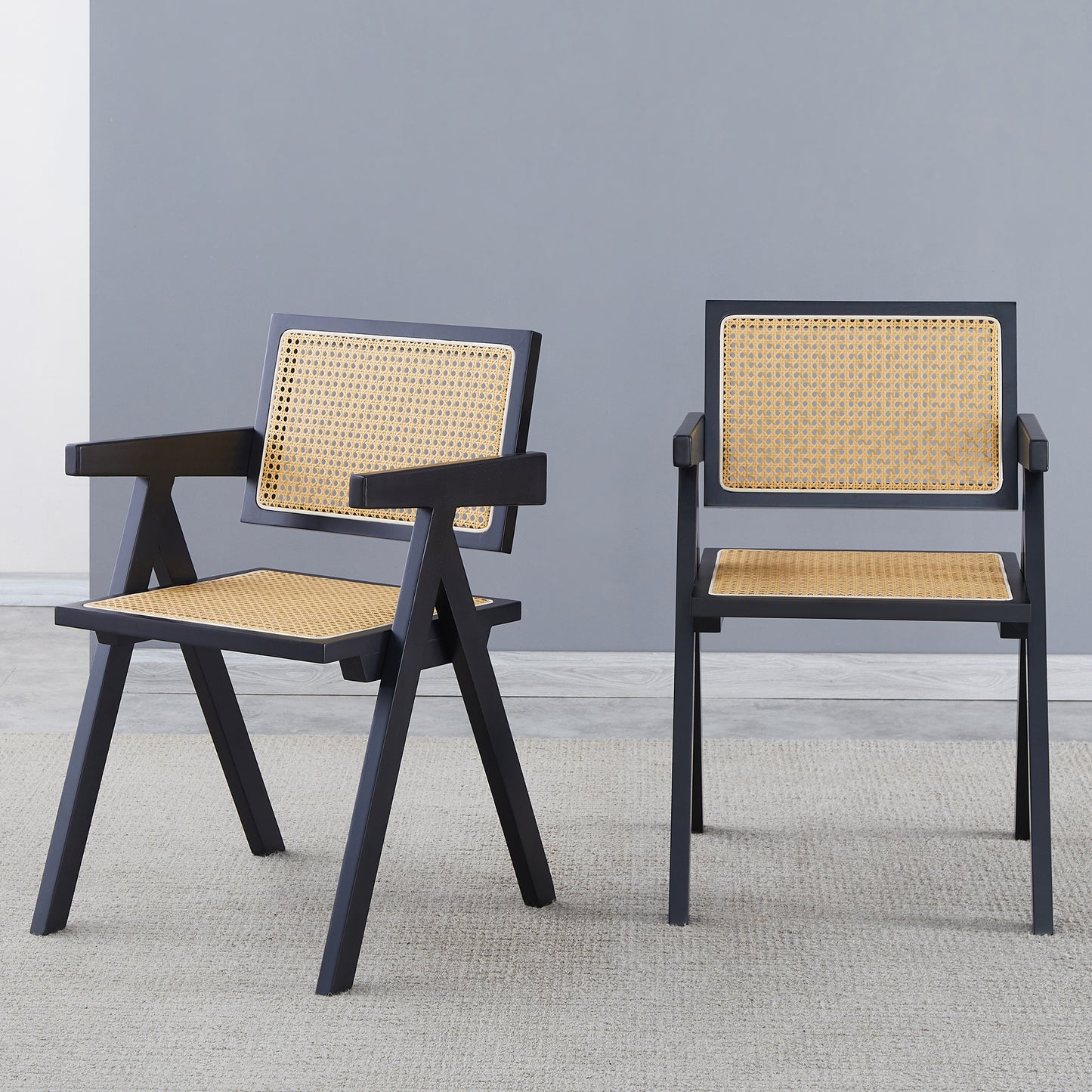 Black frame rattan accent chair with a woven seat and back