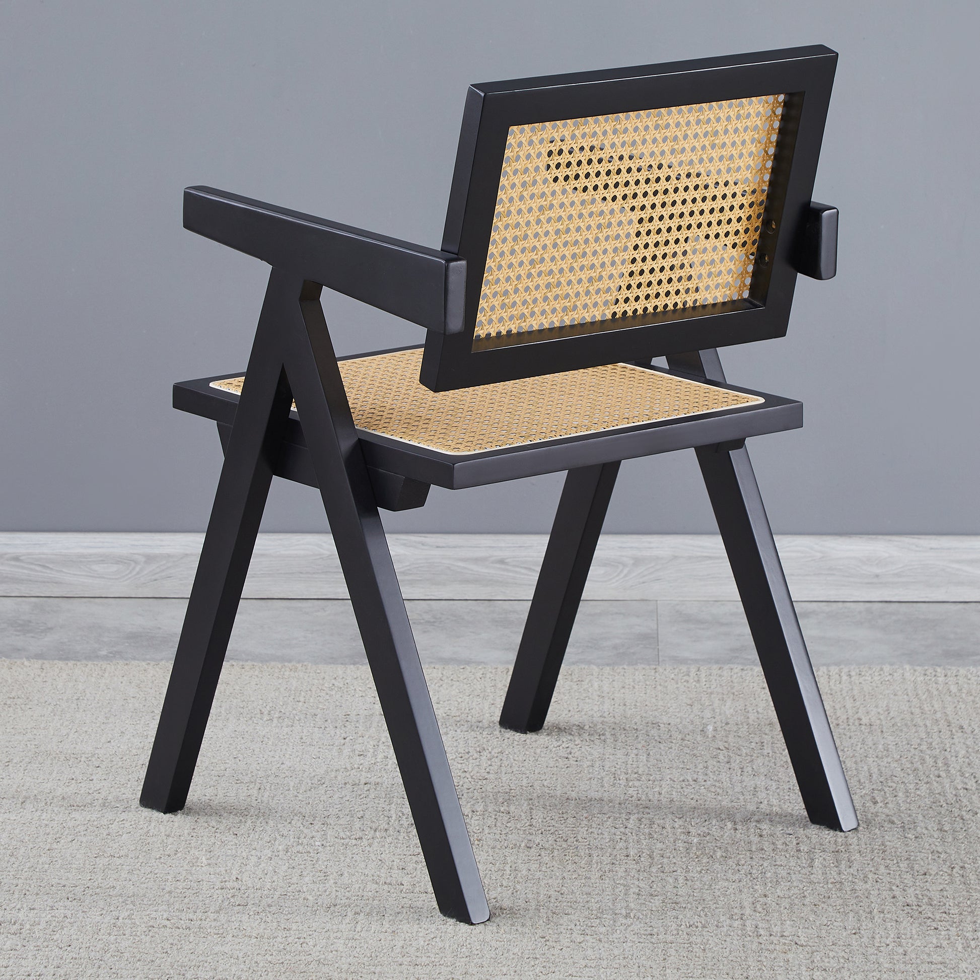 Black frame cane dining chair with natural cane seat and back
