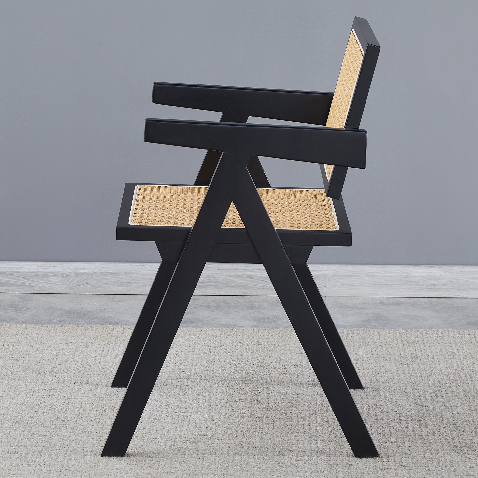 Black cane accent chair with modern angular design