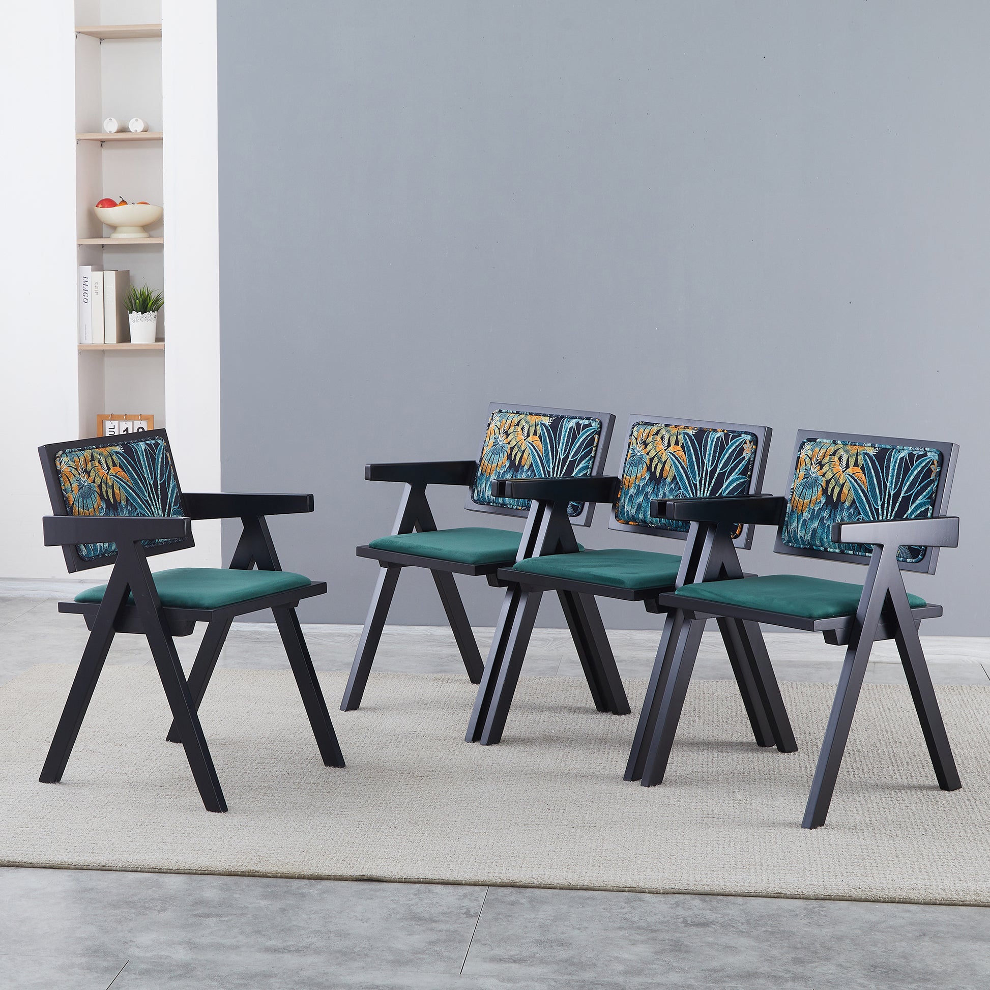 Black modern accent chair with tropical leaf print back and emerald green seat