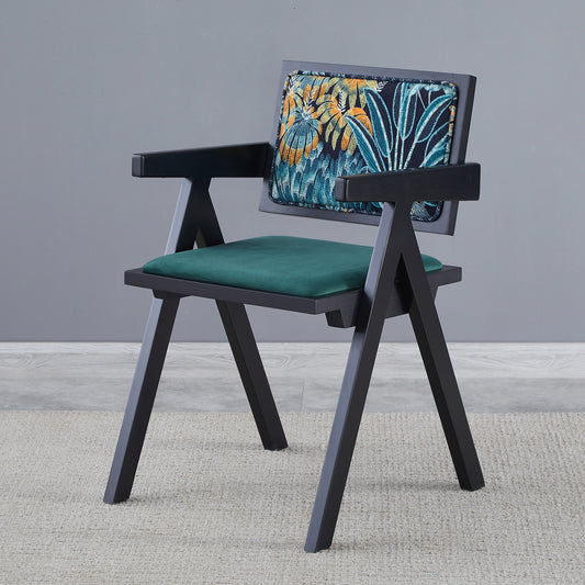 Modern armchair with black wood frame and green velvet seat
