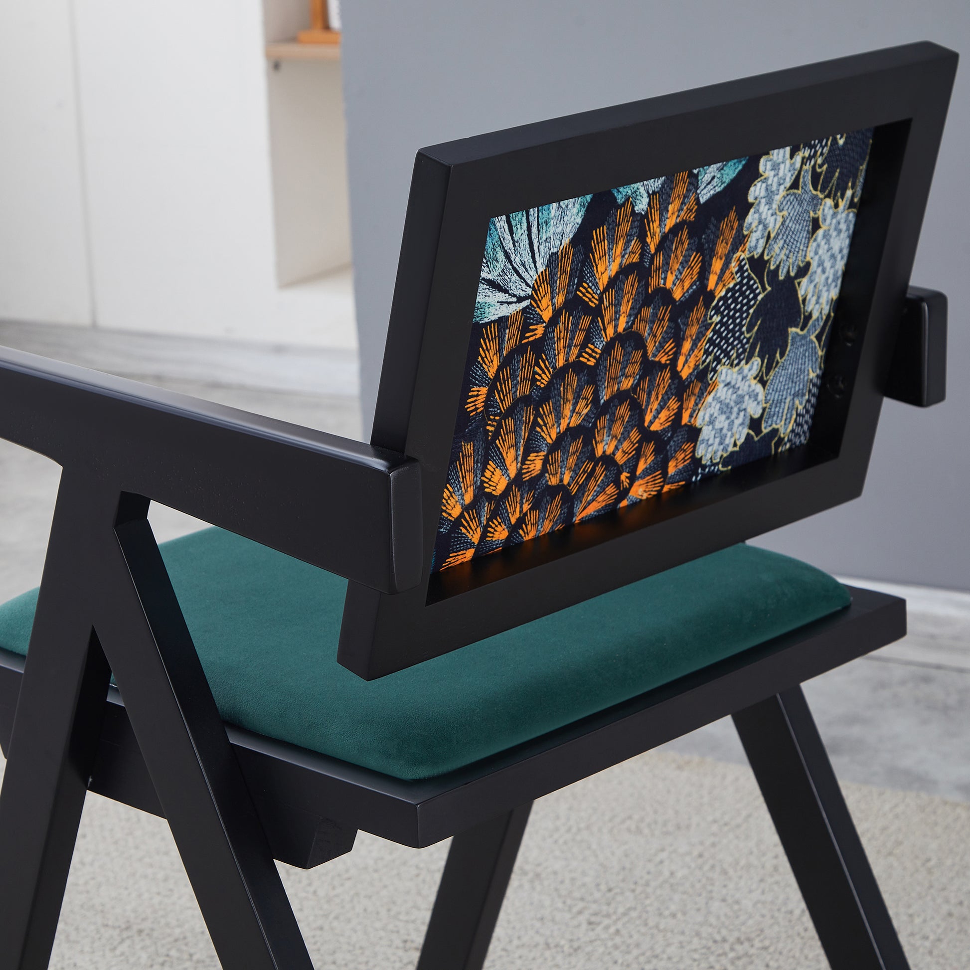 Black wood accent chair with teal velvet seat