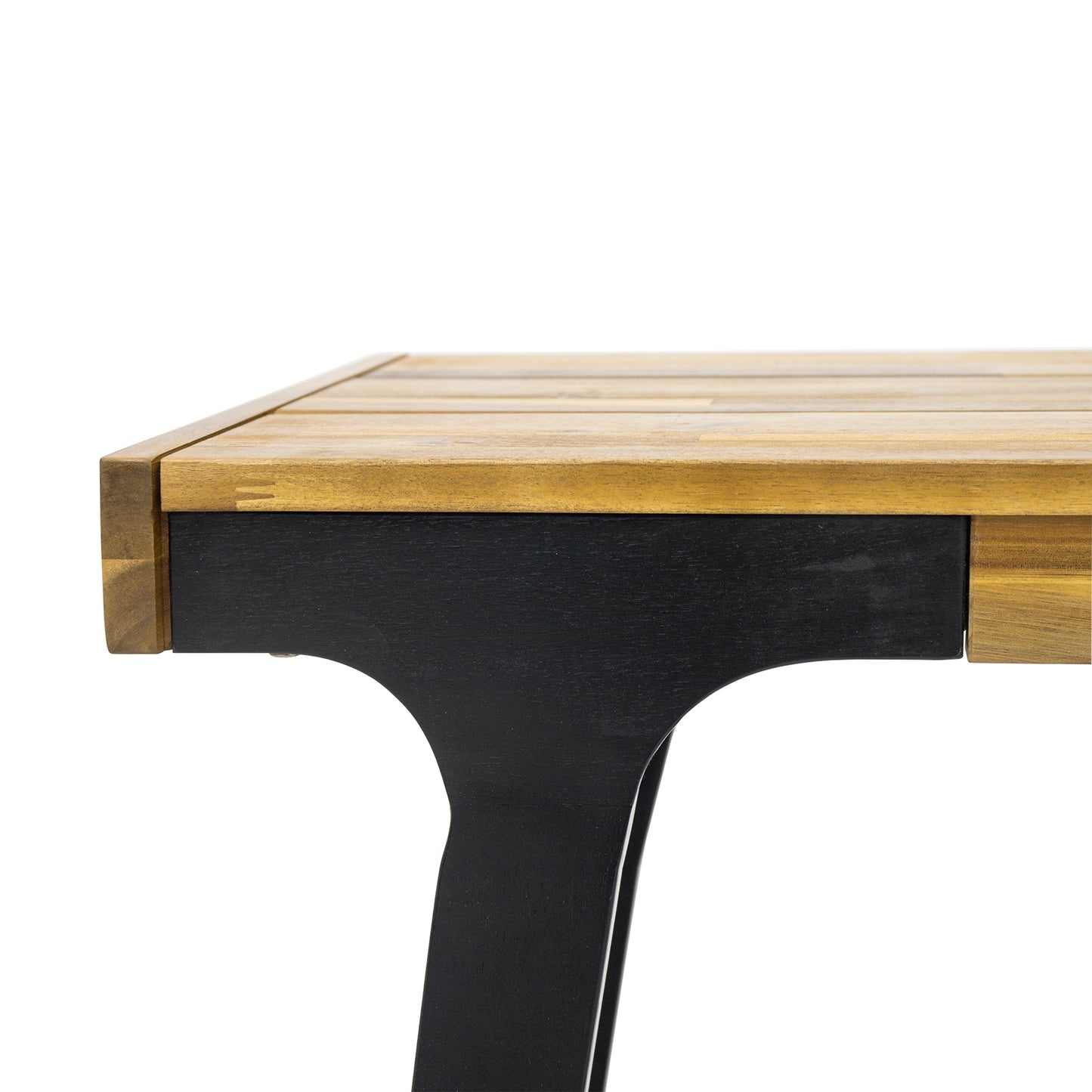 Closeup of a wooden dining table edge with black legs