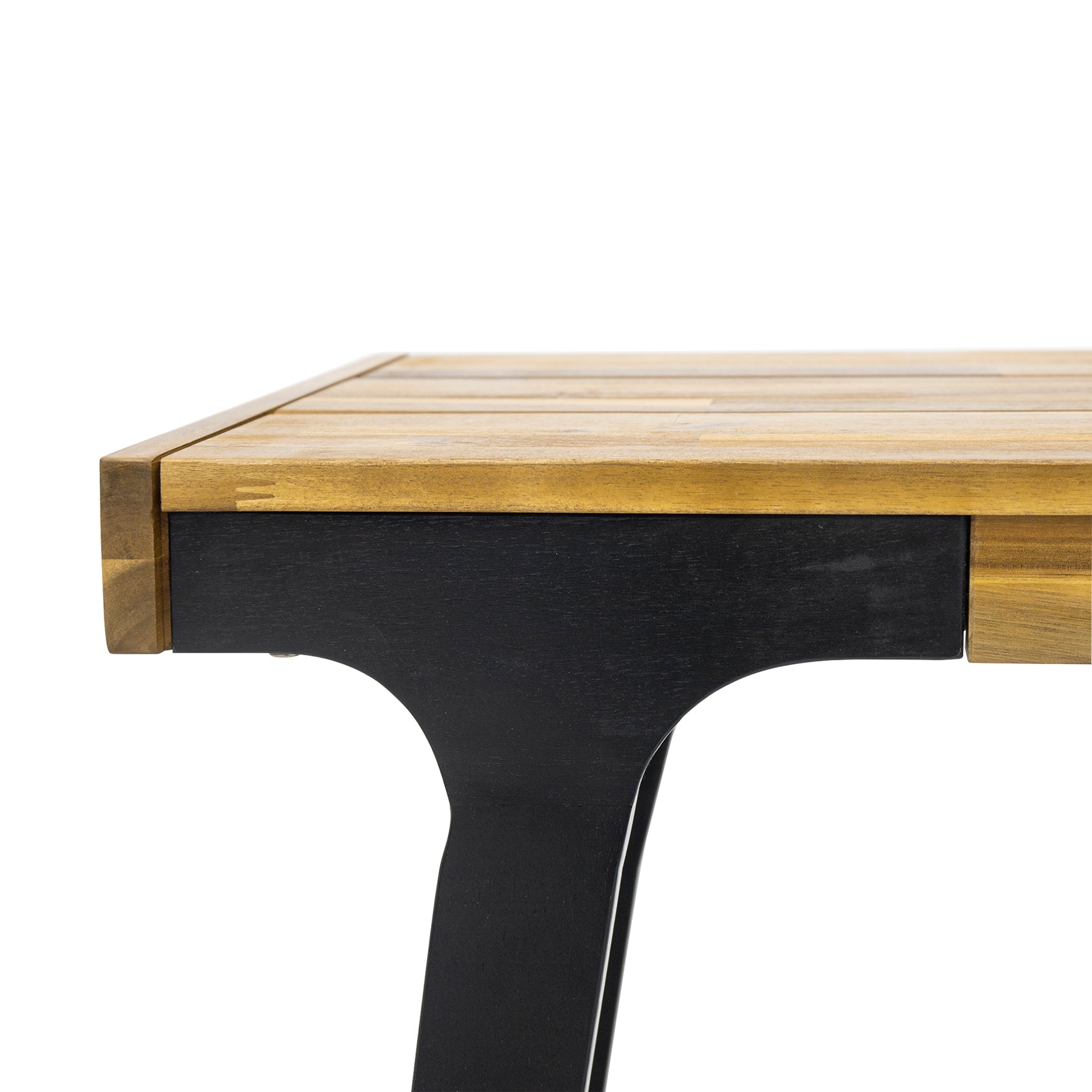 Closeup of a wooden dining table edge with black legs