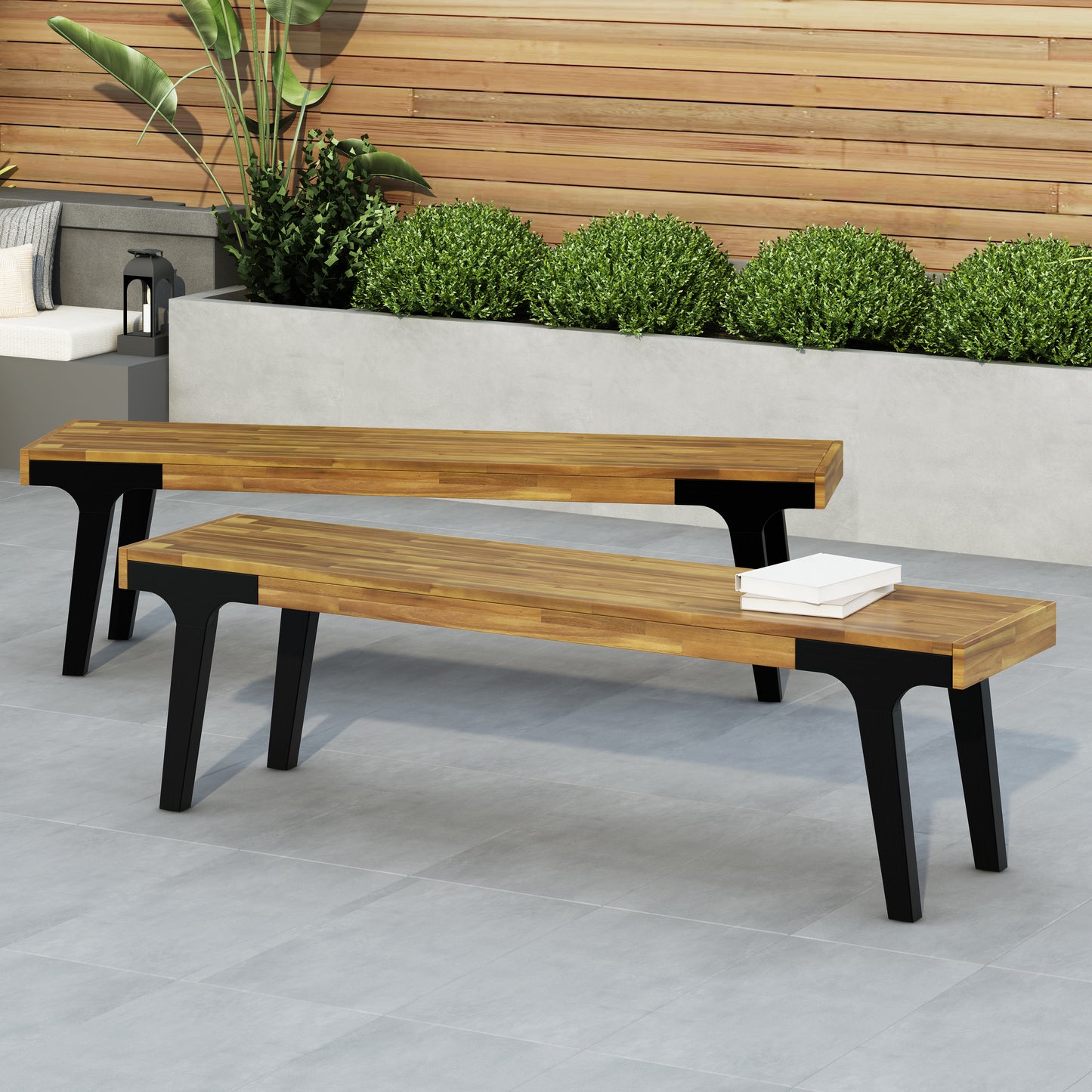 Modern outdoor bench with natural wood slats and black metal legs