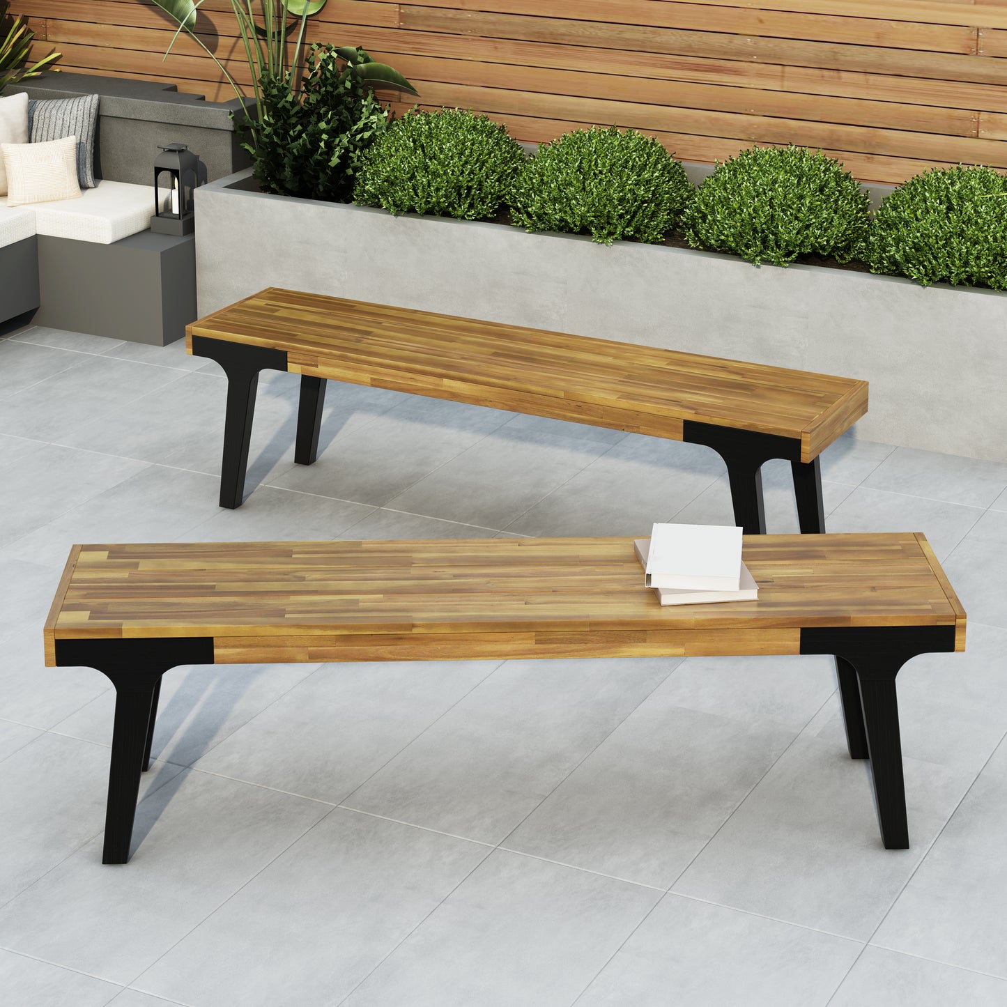 Contemporary outdoor bench with slatted wood top and black metal legs