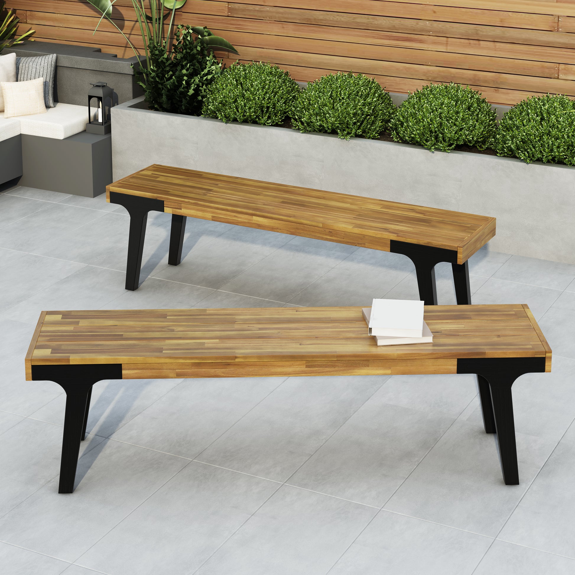 Contemporary outdoor bench with slatted wood top and black metal legs