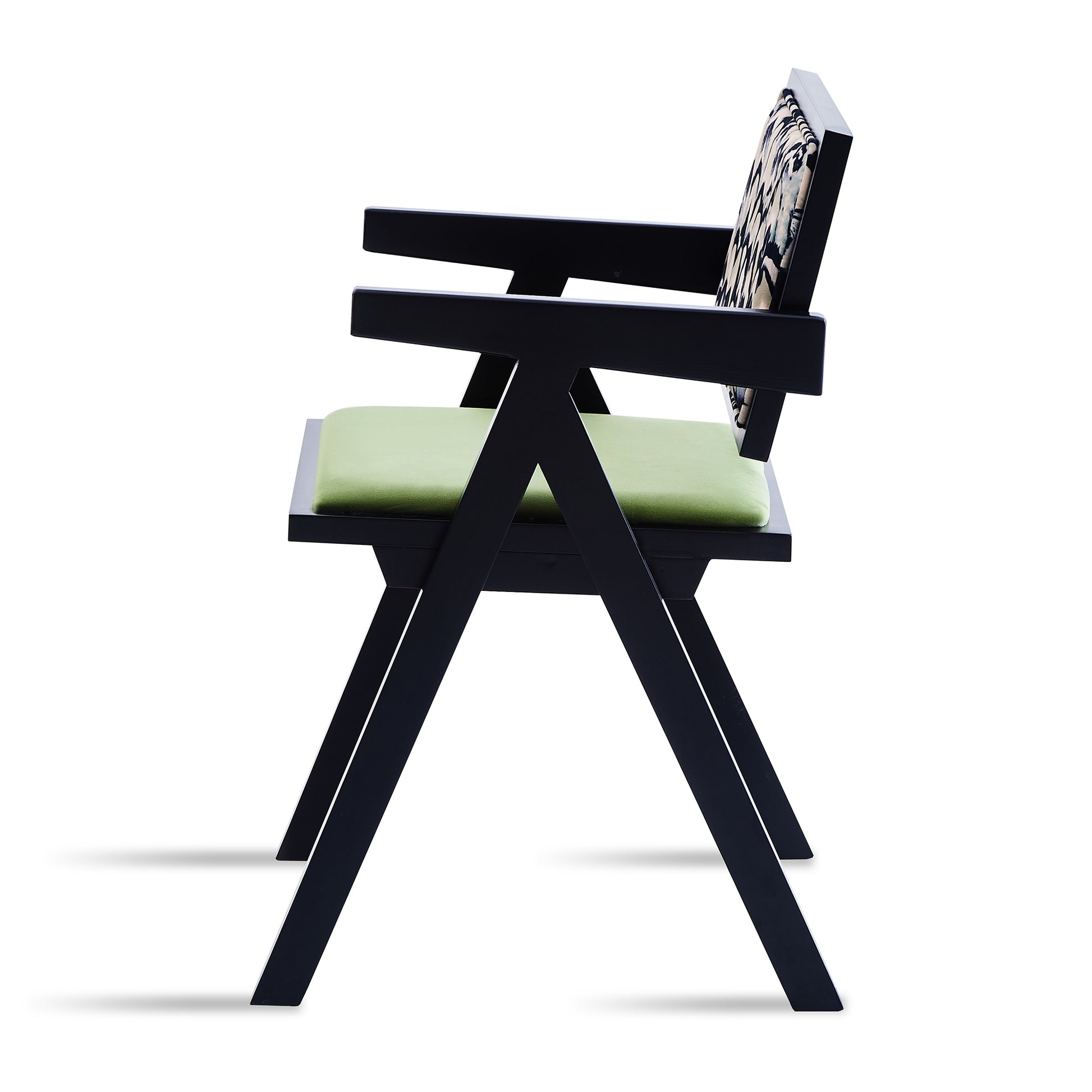 Modern black armchair with light green seat cushion and abstract patterned back